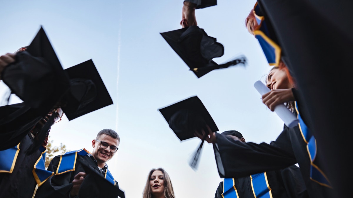 college students at graduation